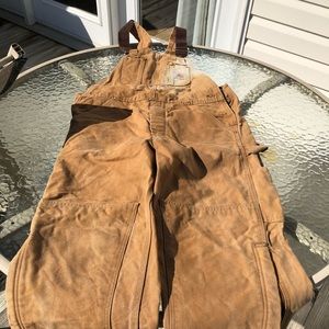 Carhartt bibs with leg zippers.